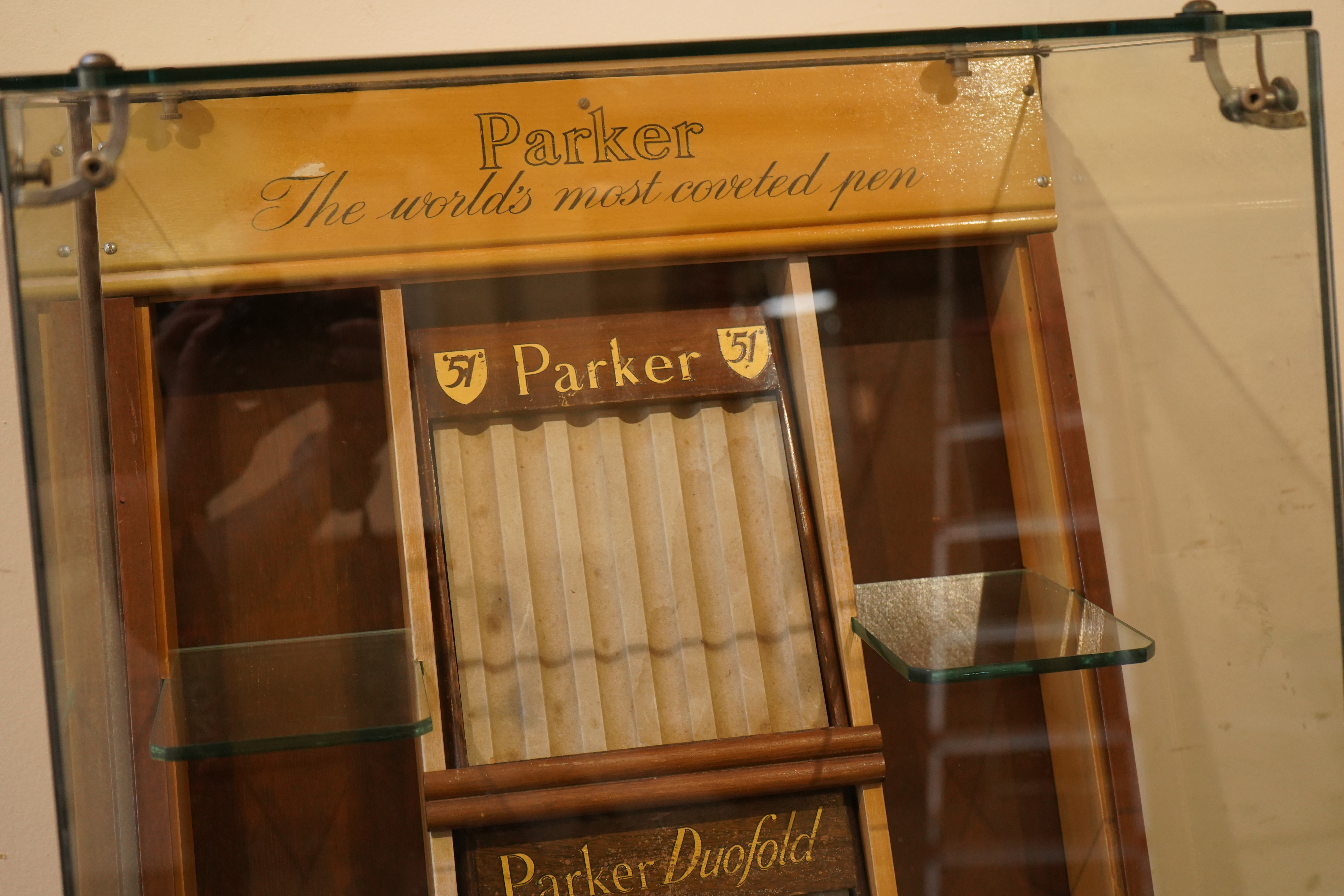 A very rare Parker Shop display cabinet, floor mounted c.1940's, with three trays and glass shelves for Parker '51's', 'Dufolds' and 'Victory's'